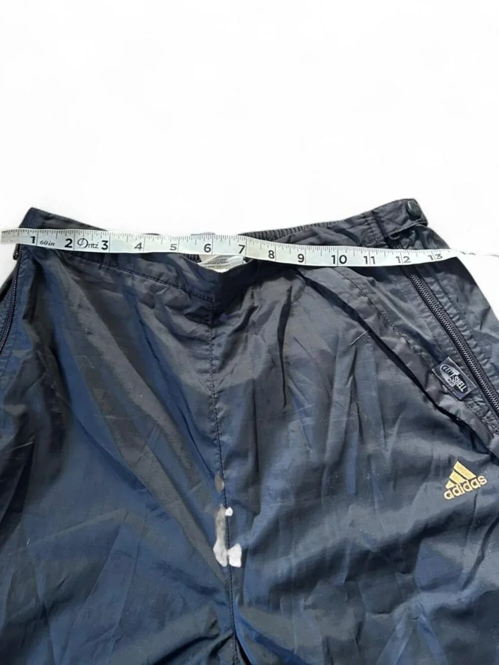 Adidas navy track pants with yellow stripes and zipper pockets size medium